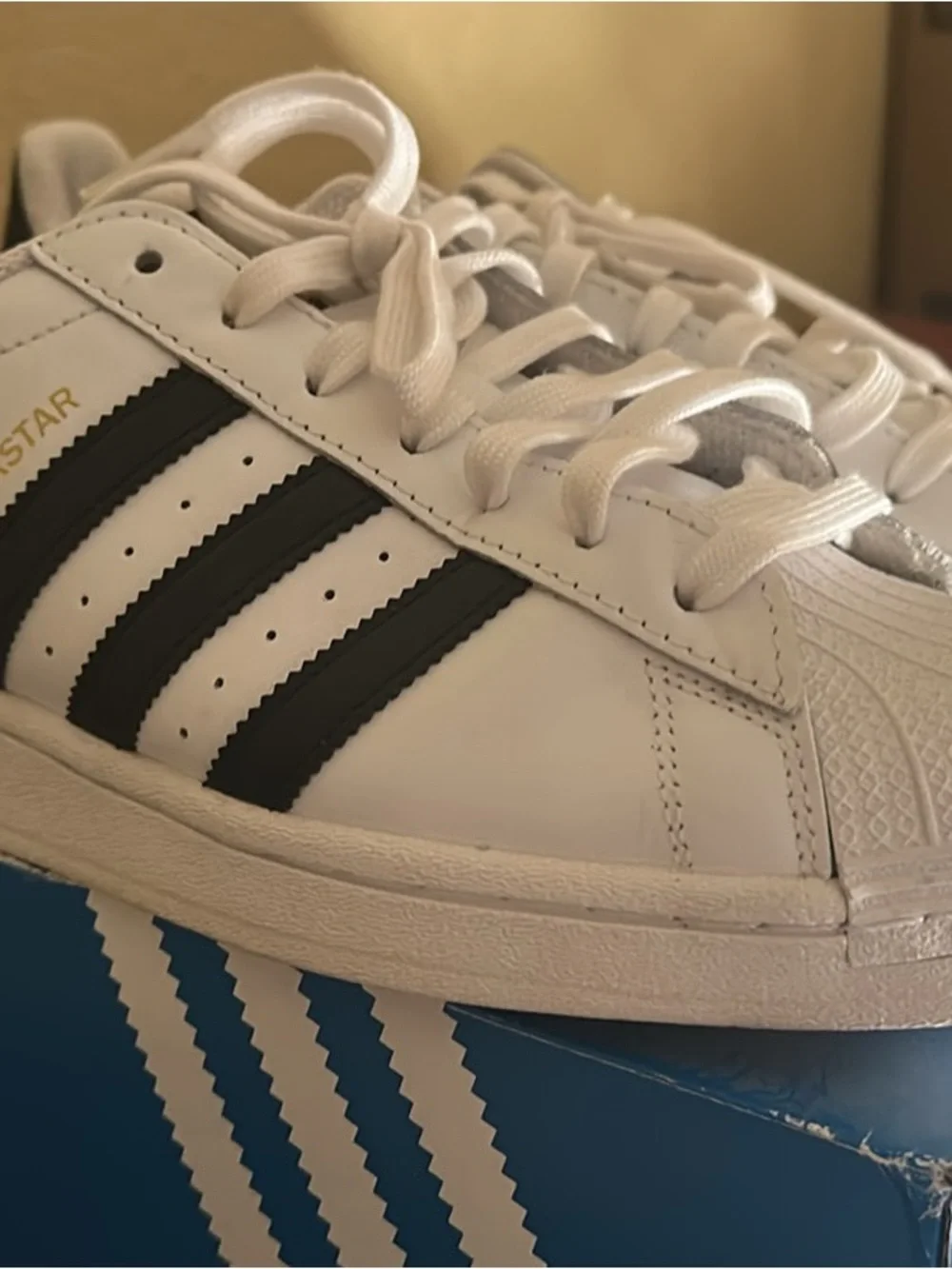 adidas Superstar white and black sneakers